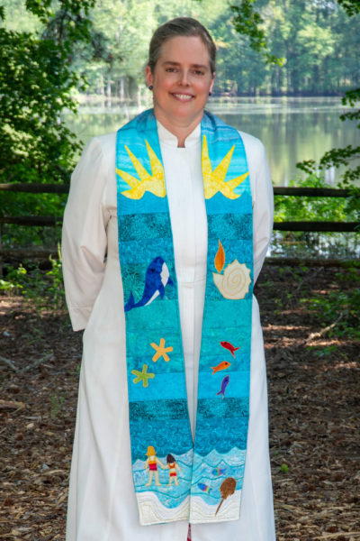 Rev. heather wearing the stole presented to her by UUSD