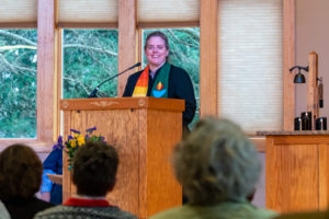 Rev. Heather speaking from the pulpit