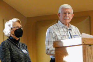 Judy and Mike Hall at the podium at UUSD.