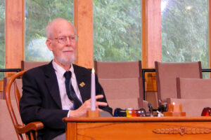 Rev. Dave Hunter sitting in the chancel at the. beginning of the service