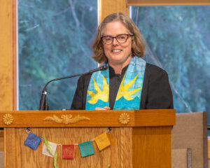 Rev. Heather at the podium.