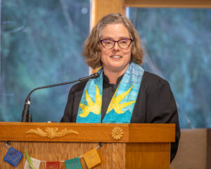 Rev. Heather at the podium.