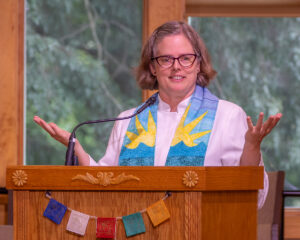 Rev. Heather at the podium.