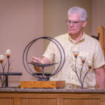 Mike Bonti lights the chalice.