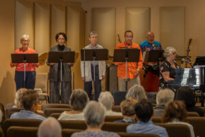 The Vocal Team sings "Namaste" as the Offertory.