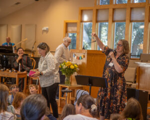 Prof. Heather and Rev Heather lead the Blessing of the Backpacks.