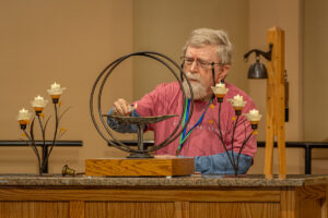 Rand Lytton lights the Chalice.