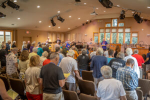 The congregation and vocal team sings "This Little Light of Mine."